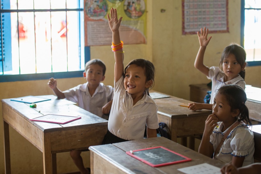 What motivates a child to do well in school, children learning to read together in a Room to Read classroom