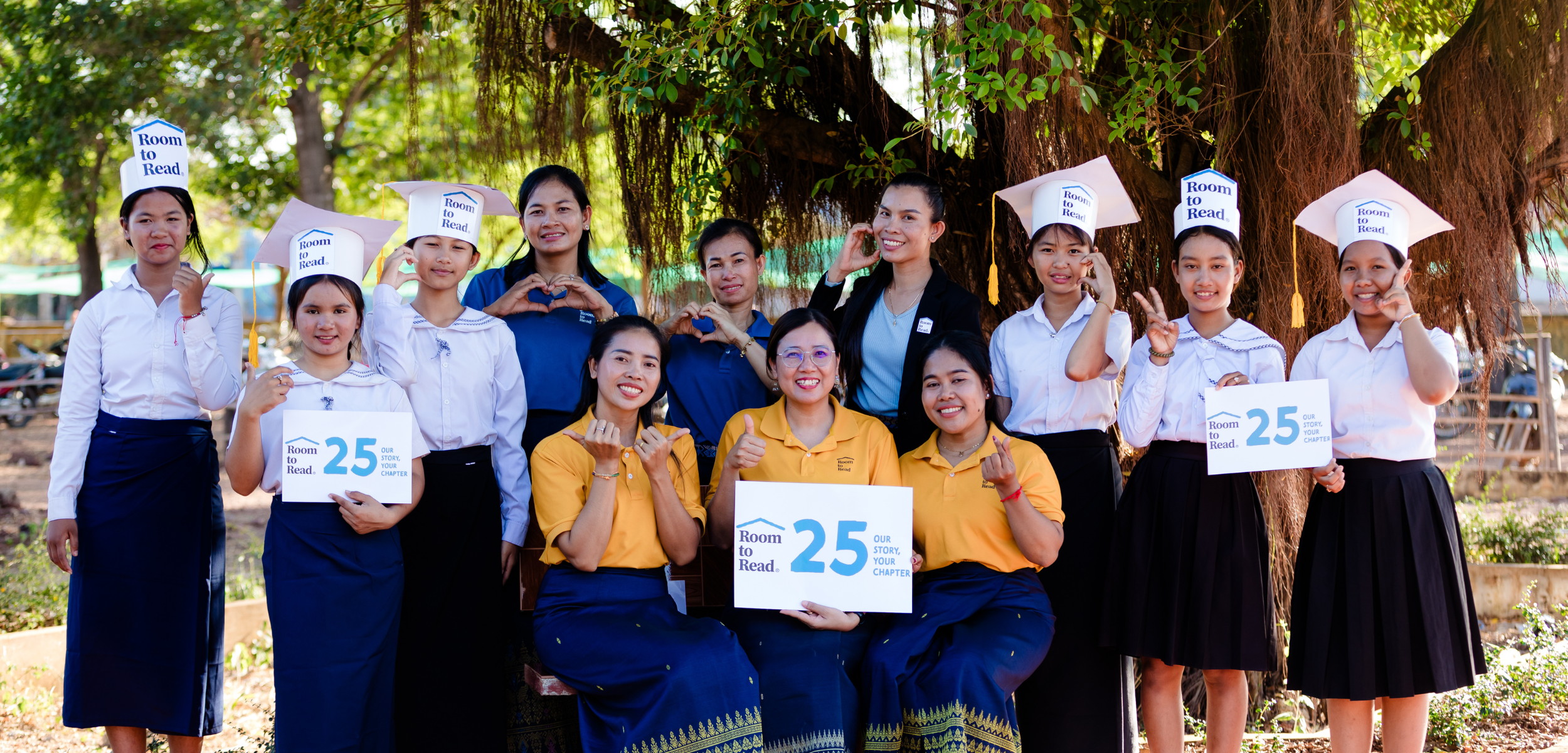 Room to Read Girls' Education Program participants stand facing the camera in Cambodia