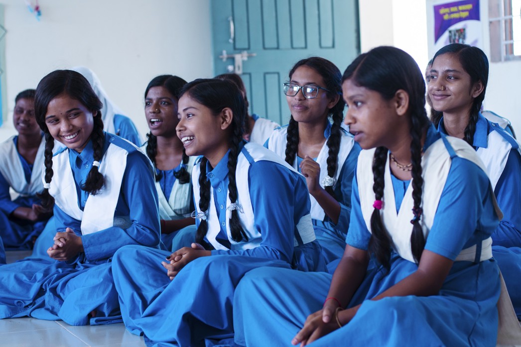 How to support girls' education, girls actively listening in a Room to Read classroom