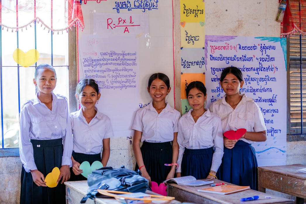 Empowering girls, a student being mentored by a Room to Read program staff member