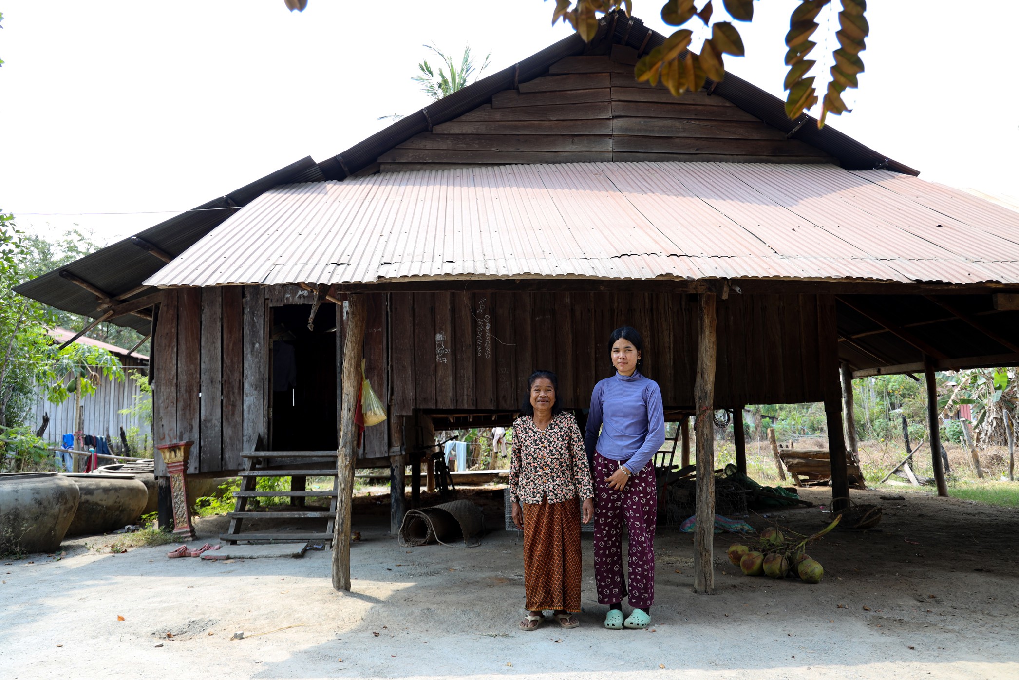 Gender equity in education, a student with her parent in their household