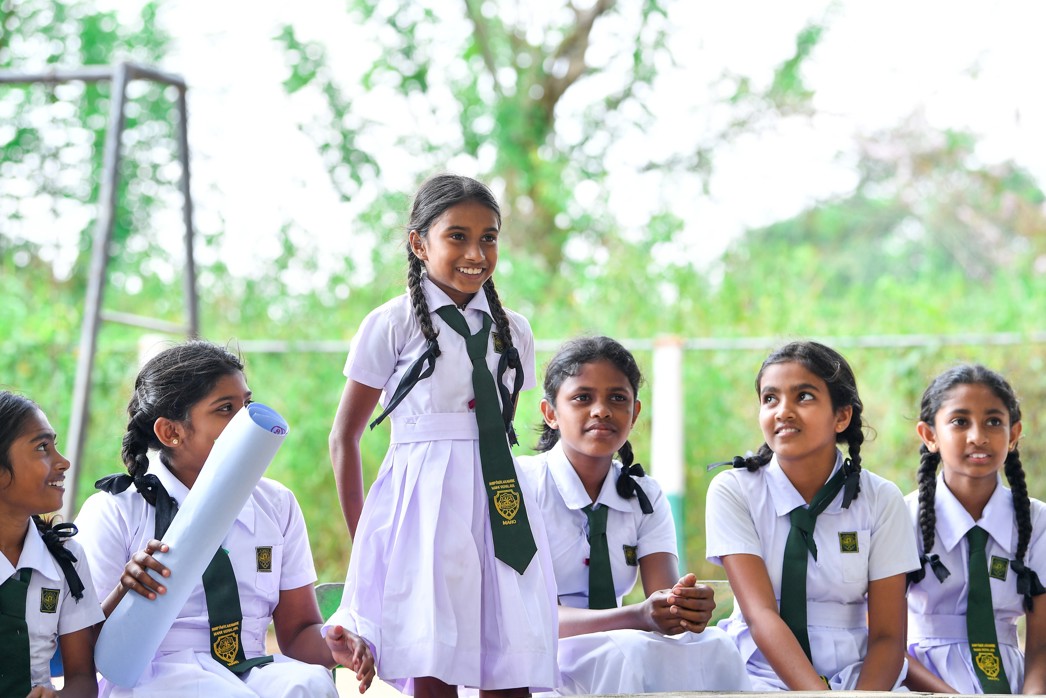 Empowering girls, girls actively participating in a Room to Read life skills session