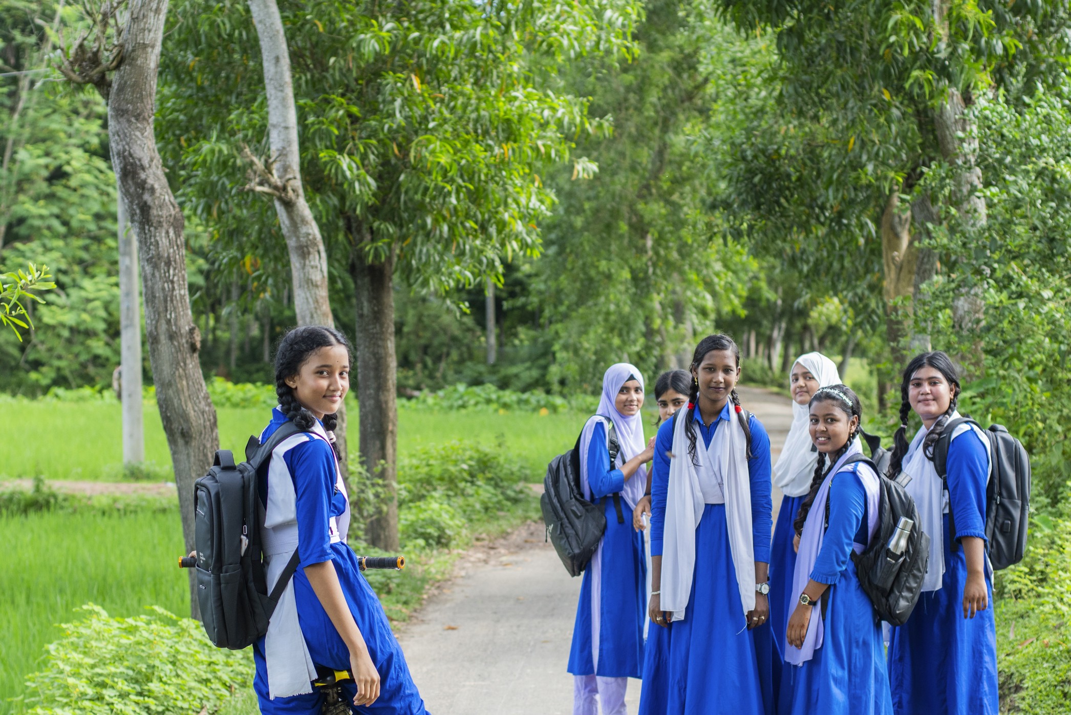 Gender equity in education, students walking together on their way to school