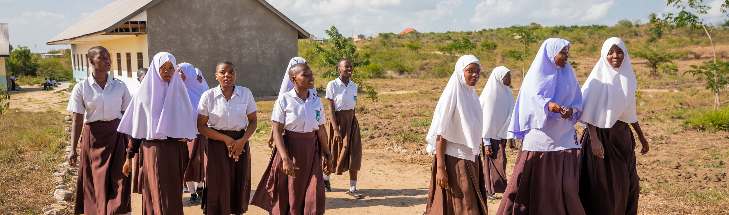 Girls education in Africa walking to school in Tanzania