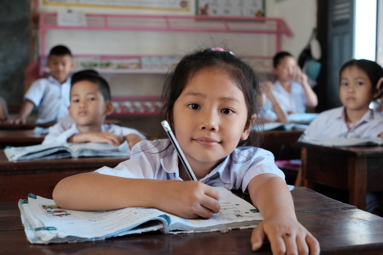 Girl sitting at a desk and reading