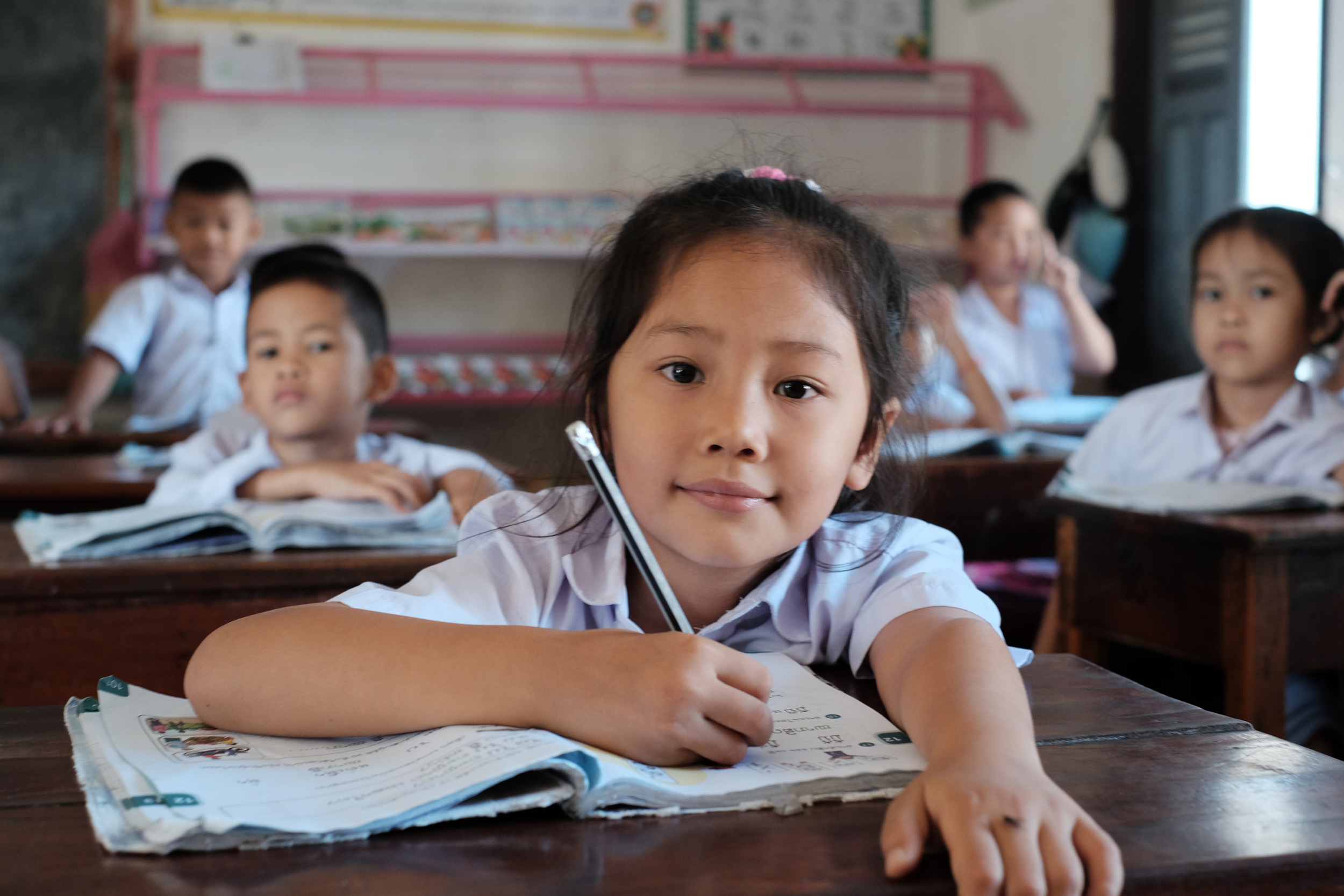 Girl sitting at a desk and reading