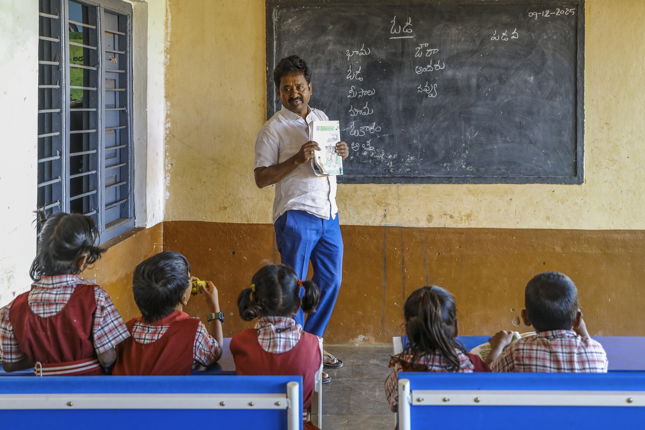 Barriers to equity in education, a teacher engaged in teaching students