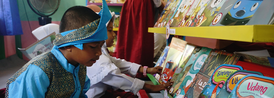 Students in Room to Read library in Indonesia