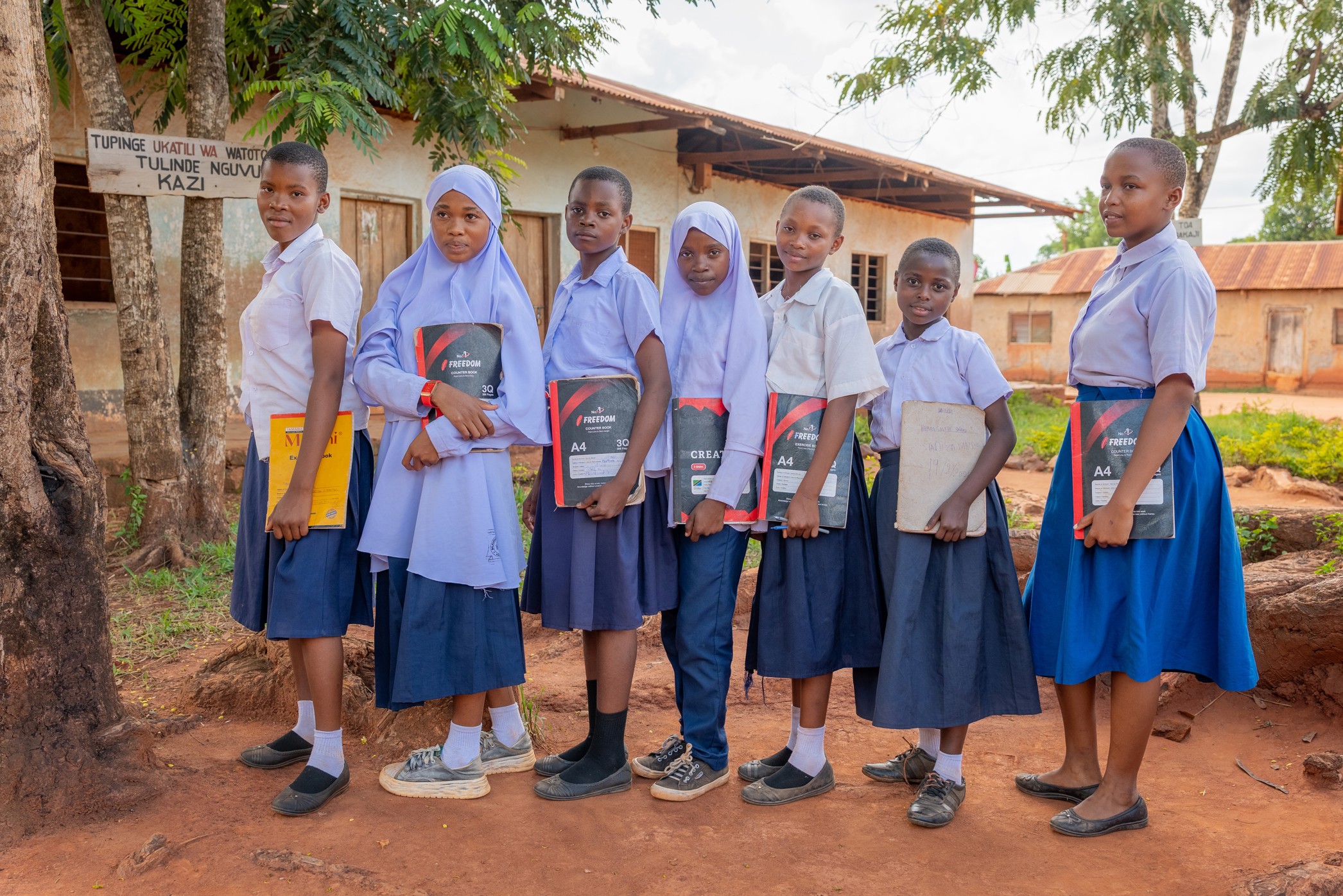 Gender equity in education, students holding their storybooks