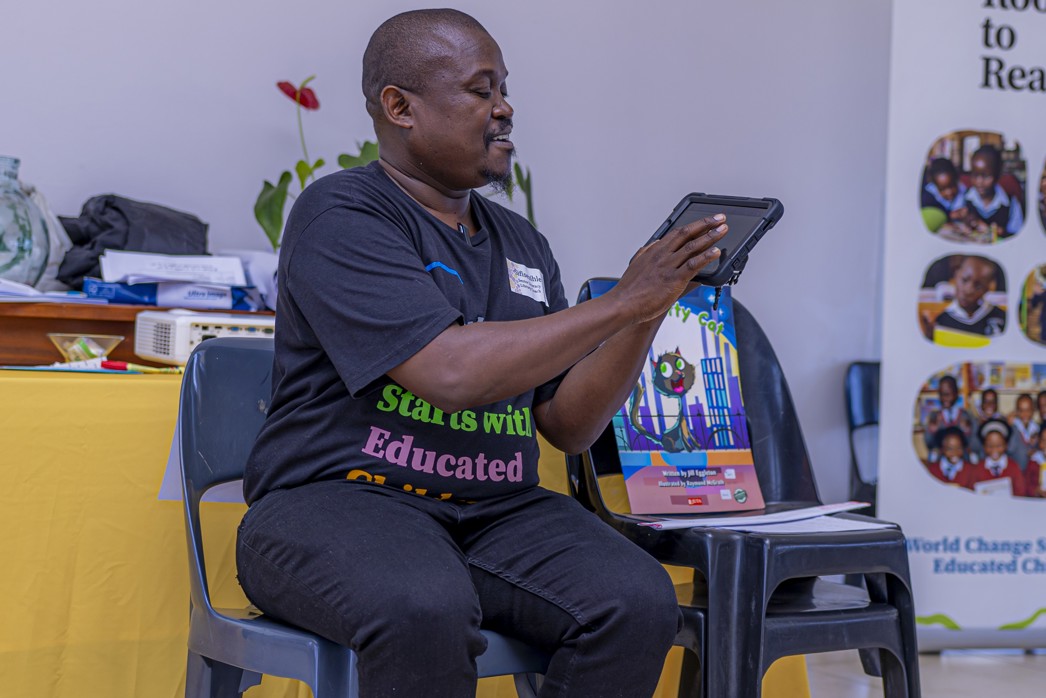 How to achieve equity in education, a teacher showing a class a lesson on a study tablet